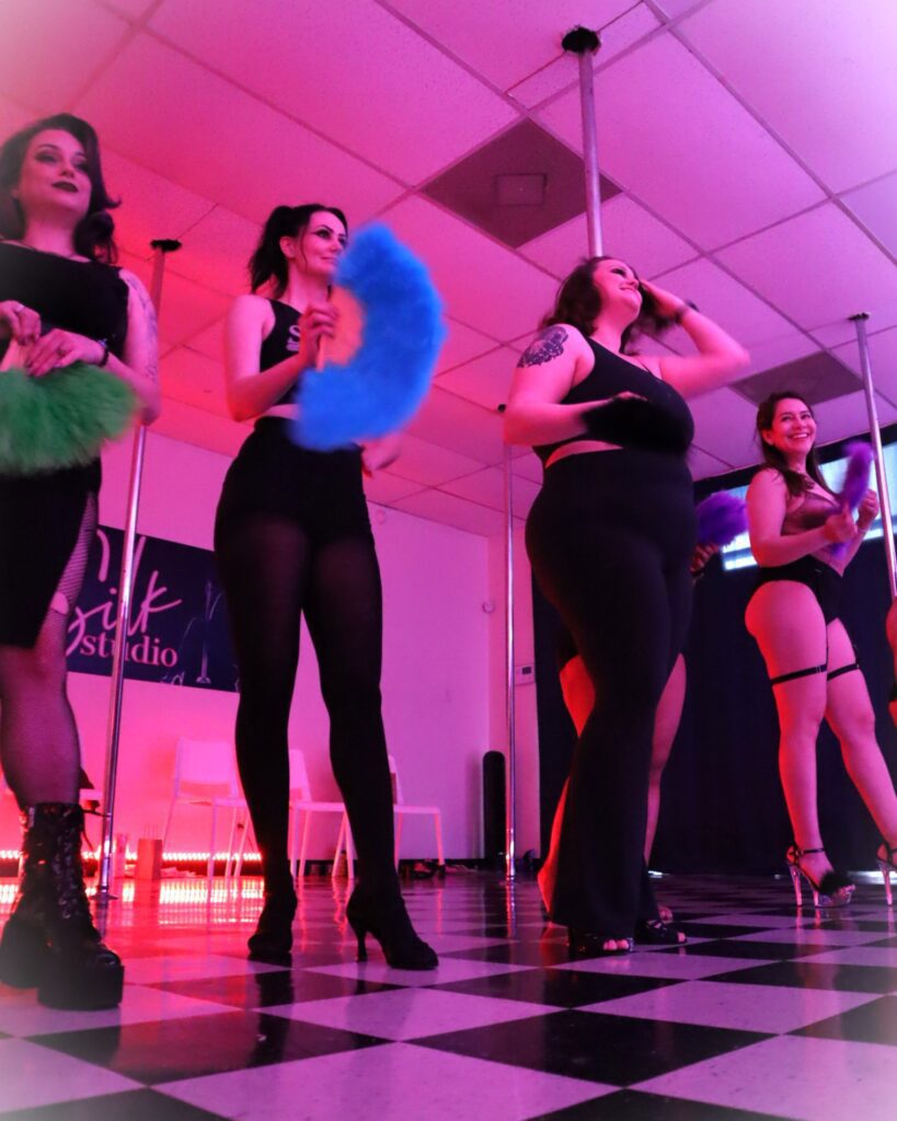 Students in action during a Galentine-themed burlesque class in Houston Texas led by Piper Daily